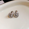Interlocking Knot Stud Earrings in Gold Tone and Silver Tone view 7