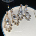 Clear Crystal Chandelier Earrings in Gold and Silver Tone view 3