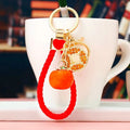 Braided Coin and Persimmon Wrist Strap Keychains in Three Colors view 1