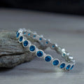 White Metal Bezel Round Eternity Band Ring Blue Clear view 1