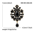 Teardrop Glass Brooch With Ornate Antique Tone Crystal Frame view 8