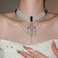 Layered White Pearl Necklace with Silver Tone Cross Charms view 1