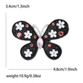 Floral Butterfly Brooch in Metal with Black Enamel Wings Dotted with Small Flowers view 5