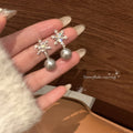 Silver Tone Snowflake and Pearl Stud Earrings Decorative Jewelry Pair view 1