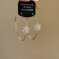 Silver Tone Hoop Earrings With Crystal Snowflake Charms view 4
