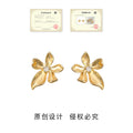Gold Ribbon Petal Flower Stud Earrings Center Crystal Accent view 3