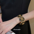 Gold Black Rose Stretch Bracelet and Round Disc Wire Cuff view 3