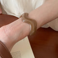 Brown Segmented Closed Bangle And Nine Wavy Open Resin Cuffs view 11