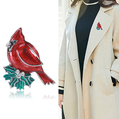 Cardinal brooch product close-up and worn on cream coat lapel