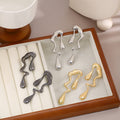 Gold and Black Melting Drop Abstract Statement Earrings view 1
