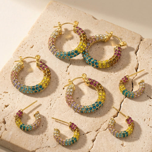 Grouped style view of rainbow crystal C hoop earrings in main image 1.