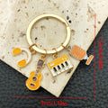 Four Guitar Keyboard and Headphone Metal Keychain Designs view 8