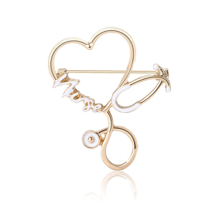 Main front view of Gold Tone Heart Stethoscope Brooch In White And Black