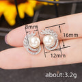 Silver Tone Faux Pearl Stud Earrings with Leaf CZ Accents view 4