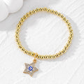 Gold Tone Beaded Crystal Evil Eye Flower Star and Cross Bracelets view 7