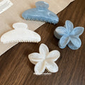 Four Blue And White Marbled Hair Claws In Standard Or Flower Shapes view 1