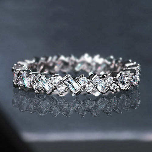Silver-tone eternity band with alternating baguette and round stones