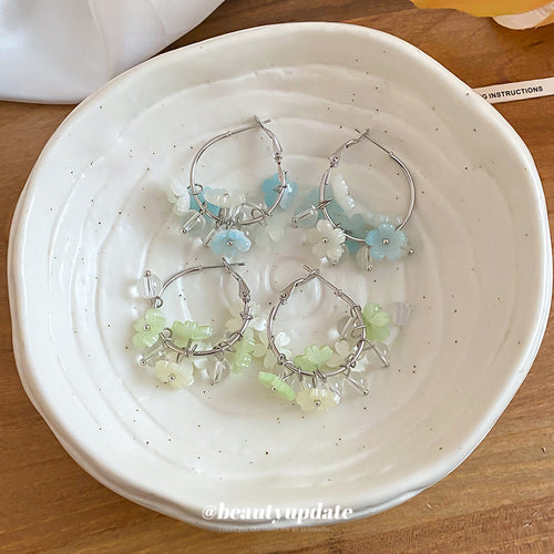 displayed product view of pastel flower hoop earrings