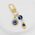 Gold Tone Evil Eye Charm Keychain With Hamsa Hand Accent view 4