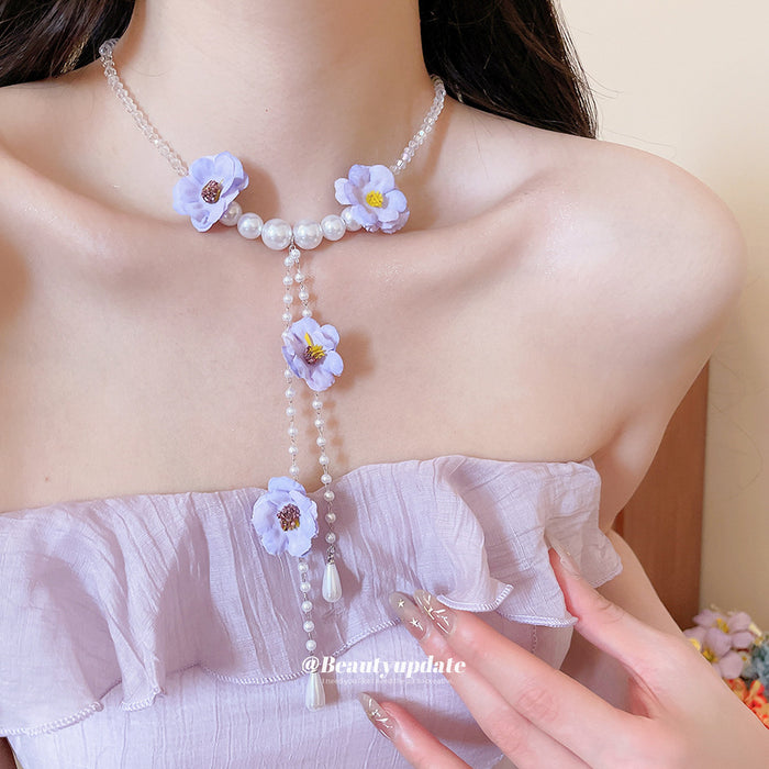 Purple Flower Pearl Lariat Necklace with White Beads and Long Drop