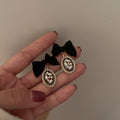 Black Bow Oval Crystal Drop Statement Earrings Pair view 1
