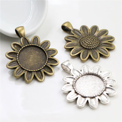 Sunflower Round Cabochon Pendant Bases in Two Finishes shown in a grouped front view