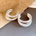Triple Curved Hoop Earrings with Black Dot Details view 7