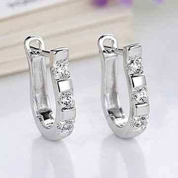 Silver Tone U Shaped Huggie Earrings With Three Clear Stones