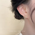 Gold Mini Bow Stud Earrings Clear CZ White Pearl Drop view 2