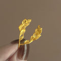 Gold Tone Curved Leaf Hook Earrings With Decorative Metal Details view 3