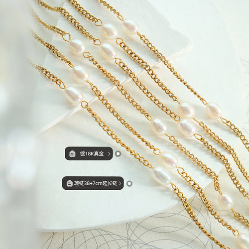 Gold pearl station chains flat lay with plating and length labels