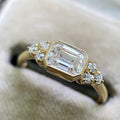 Gold Emerald Cut Clear Stone Bezel Ring Side Accents view 1