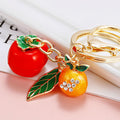 Leaf, Persimmon and Orange Charm Keychains in Three Pictured Colors view 1