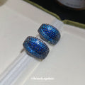 Pair of Metal Tone Blue Crystal Pave Rounded Hoop Earrings view 3