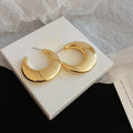 Pair of Metal Tone Wide Polished C-Shaped Hoop Earrings in Two Sizes view 7