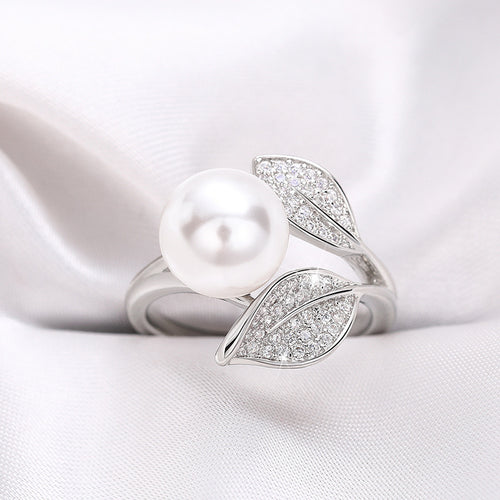 Close front of pearl and dual pavé leaf ring white metal