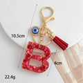 Red Resin Shell Letter Keychain with Evil Eye and Tassel view 2