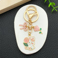 Thirteen Pink Bow Rose and Rabbit Metal Keychain Designs view 2