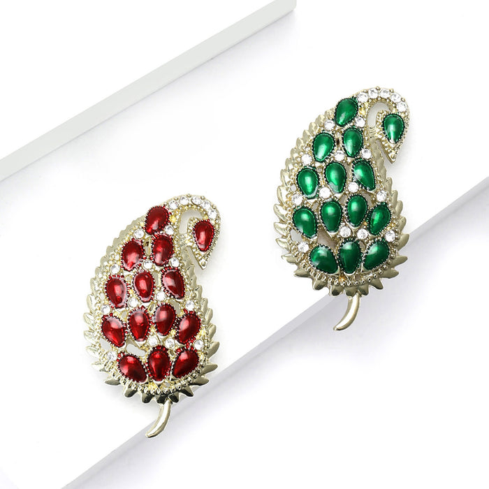 Crystal Paisley Leaf Brooch With Polished Metal And Sculpted Decorative Details