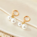 Gold Tone Double Faux Pearl Huggie Drop Earrings in Graduated Sizes view 3
