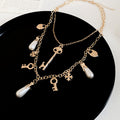 Gold Tone Layered Charm Necklaces With Decorative Accents view 8