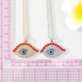 Gold and Silver Tone Red Crystal Lash Eye Pendant Necklaces view 3