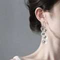Silver Tone Clear Disc Cascade Long Hook Drop Earrings view 1