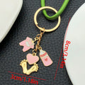 Eight Pink Baby Outfit and Footprint Metal Keychain Designs view 8