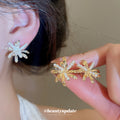 Crystal Flower Clip On Earrings In Silver And Gold Tones view 1