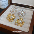Pearl Center Radiating Flower Clip On Earrings With Polished Metal Details view 1