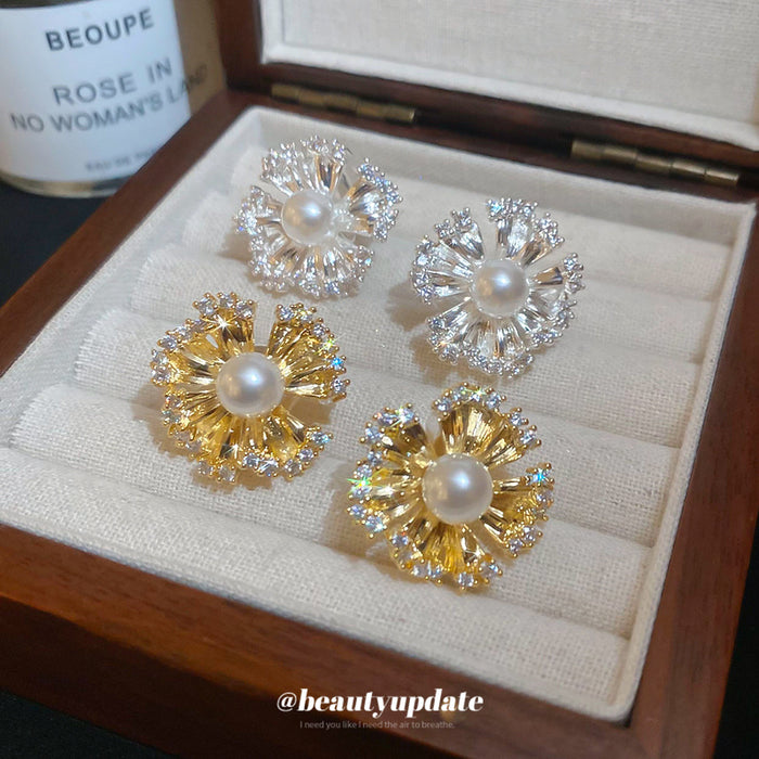 Pearl Center Radiating Flower Clip On Earrings With Polished Metal Details