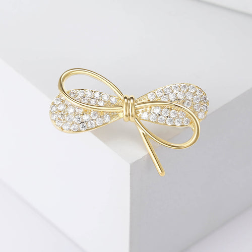 Silver mini bow brooch close-up