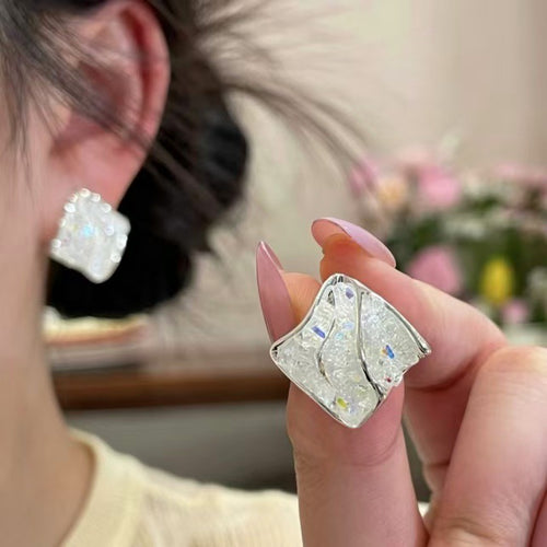 Styled view of clear crushed ice square statement stud earrings fashion jewelry