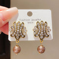 Gold Crystal Scroll Earrings With Brown Pearl Drops view 3